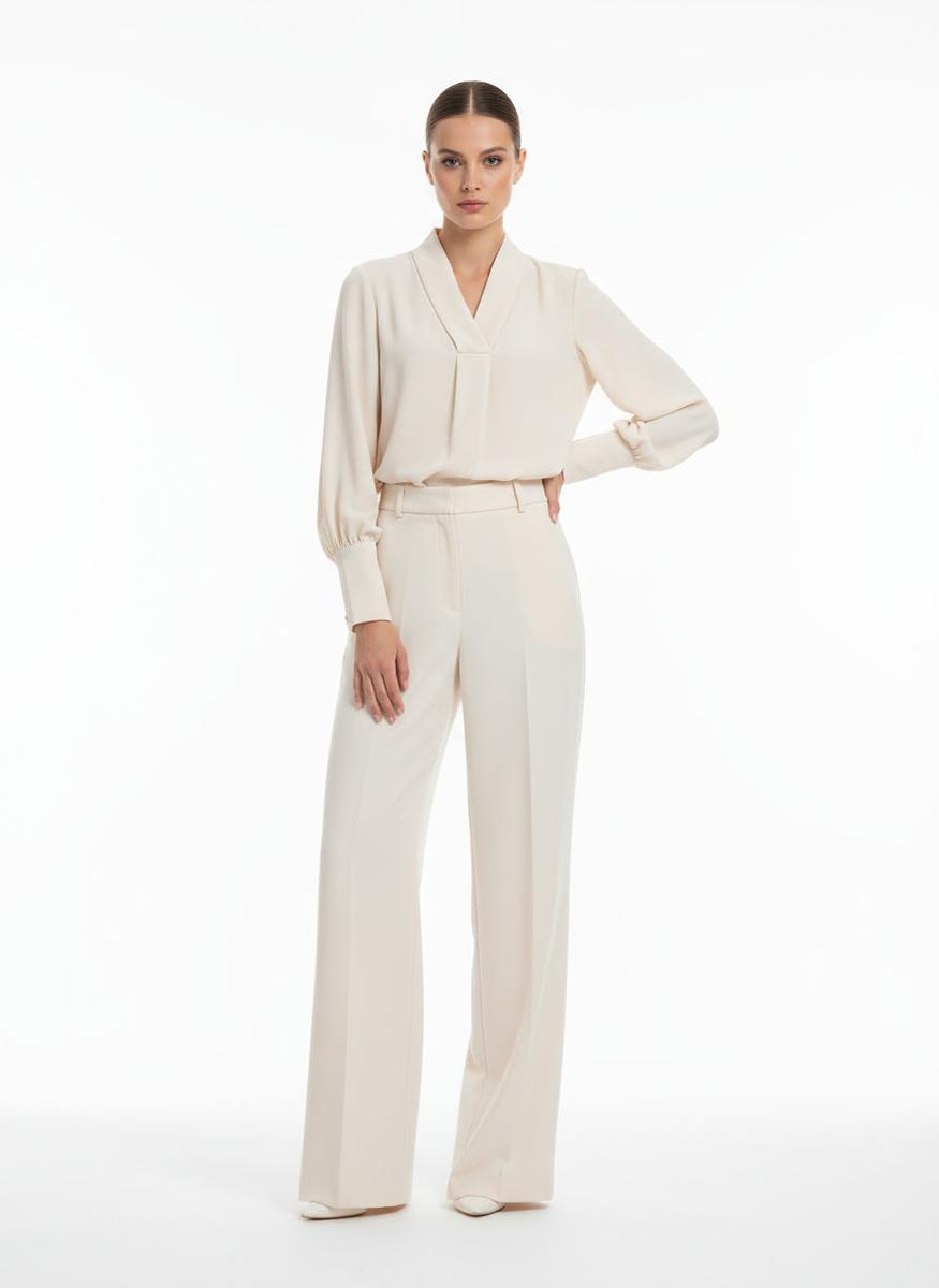 Blusa morbida con polsini