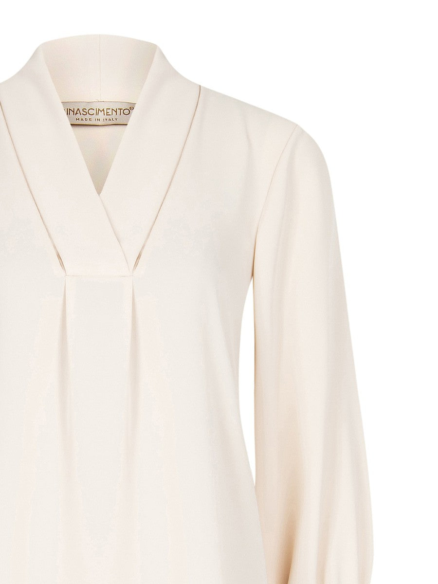 Blusa morbida con polsini