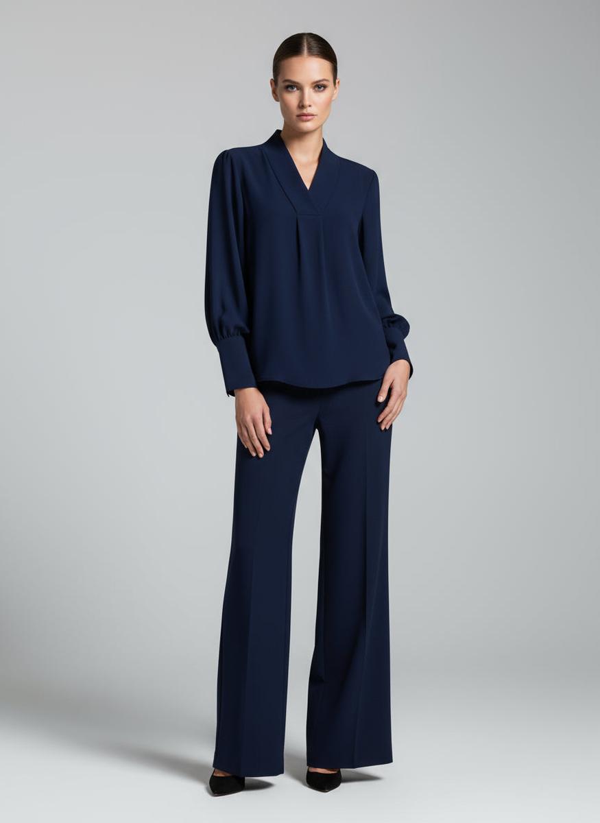 Blusa morbida con polsini